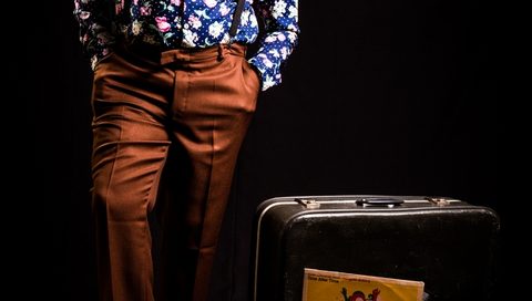 Fashion shot of a man with a vintage suitcase